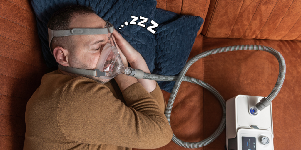 man-sleeping-with-sleep-apnea-machine
